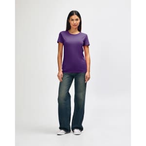 A purple Gildan Heavy Cotton Ladies' T-Shirt displayed on a model paired with blue jeans and white sneakers.