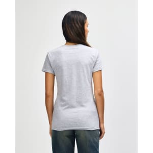 A women's grey Gildan Heavy Cotton T-shirt displayed from the back, featuring a simple design and short sleeves.