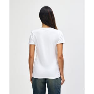 A white ladies' t-shirt with a fitted design, featuring a logo on the back, worn with blue jeans.