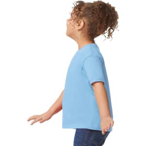 A toddler wearing a light blue Gildan Heavy Cotton T-Shirt, displayed from the side with curly hair.