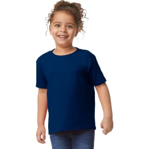 A toddler wearing a navy blue Gildan Heavy Cotton T-Shirt, smiling and standing with hands on hips.
