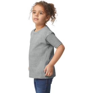 A grey toddler t-shirt displayed on a child, featuring short sleeves and a round neckline, with a logo visible.