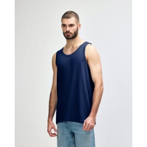 A navy blue Gildan Heavy Cotton adult tank top with wide shoulder straps, displayed on a male model.