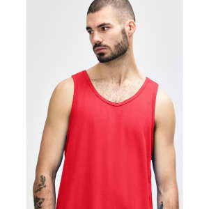 A red Gildan Heavy Cotton adult tank top displayed on a model with short, curly hair and a neutral background.