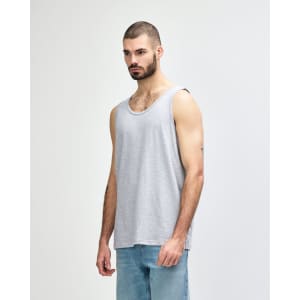 A grey Gildan Heavy Cotton adult tank top displayed on a model, featuring a plain design and a logo.