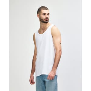 A white Gildan Heavy Cotton adult tank top displayed on a male model, with a simple logo present.