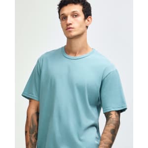 A unisex short sleeve t-shirt in a light blue colour, featuring a casual fit and a logo.