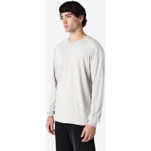 A long sleeve t-shirt in light grey, featuring a simple design and a logo on the chest.