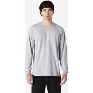 A long sleeve t-shirt in heather grey featuring a crew neckline and fitted sleeves, displayed on a model.