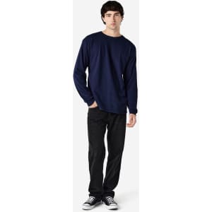 A navy Gildan Heavy Cotton adult long sleeve T-shirt displayed on a model, paired with black jeans and sneakers.