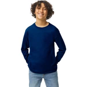 A youth long sleeve T-shirt in navy blue with a relaxed fit and logo. The model is smiling and wearing denim jeans.