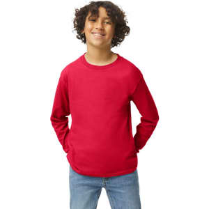 A youthful model wearing a bright red Gildan Heavy Cotton long sleeve t-shirt, paired with blue jeans.