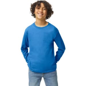 A blue Gildan Heavy Cotton youth long sleeve T-shirt worn by a smiling child, with hands in pockets.
