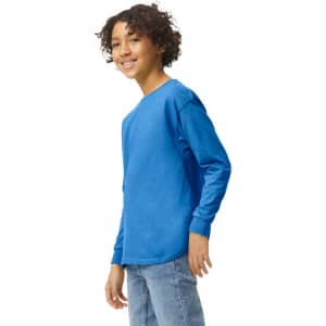 A blue long sleeve youth T-shirt with a round neck and a logo on the side, modelled by a smiling child.