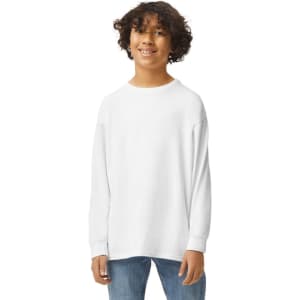 A youth wearing a white long sleeve T-shirt. The shirt has a logo on its front.