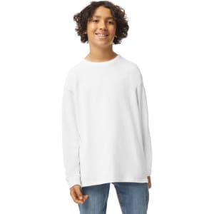 A youth model wearing a white long sleeve T-shirt, featuring a relaxed fit and a logo. Casual denim bottoms complete the outfit.