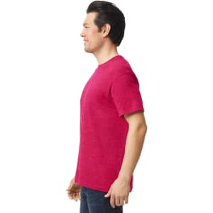 A vibrant pink Gildan Softstyle adult T-shirt displayed on a male model from the side, showcasing its relaxed fit.