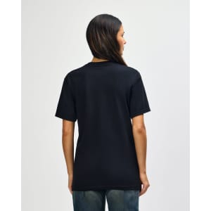A black Gildan Softstyle adult t-shirt, featuring a simple design and a logo on the back. The model is facing away.