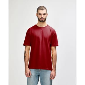 A red Gildan Softstyle adult T-shirt is displayed on a model, featuring a simple design and a branding logo.