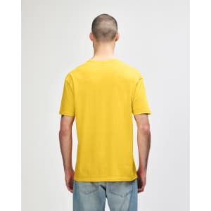 A yellow Gildan Softstyle adult T-shirt displayed from the back, featuring a plain design and a logo.