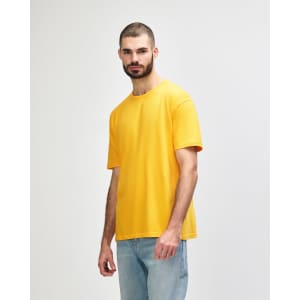 An orange Gildan Softstyle adult T-shirt is displayed on a model in profile view.