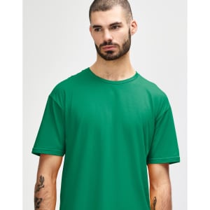 A green adult T-shirt displayed on a model, featuring short sleeves and a relaxed fit. It has a logo on it.