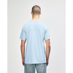 A light blue Gildan Softstyle adult t-shirt viewed from the back, featuring a simple design and a branding logo.