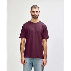 A maroon Gildan Softstyle adult t-shirt displayed on a male model against a neutral background. The shirt has a brand logo.