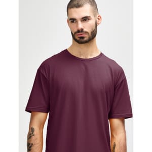 A close-up of a male model wearing a maroon Gildan Softstyle adult T-shirt with a round neckline.