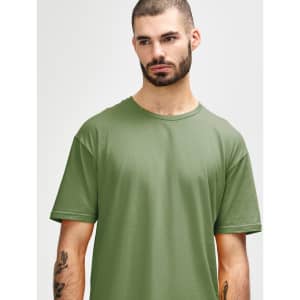 A model wearing a short-sleeved, olive green Gildan Softstyle adult t-shirt. The shirt features a simple design and a logo.