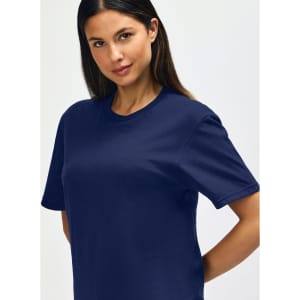 A navy Gildan Softstyle adult T-shirt on a male model, featuring a crew neck and relaxed fit.
