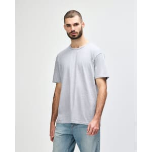 A plain grey adult t-shirt displayed on a male model, featuring a relaxed fit and short sleeves.
