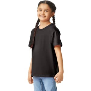 A black Gildan Youth Softstyle short sleeve T-shirt worn by a girl with braids, standing casually.