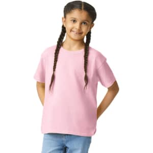 A youth softstyle short sleeve t-shirt in pink, worn by a girl with braided hair, smiling at the camera.