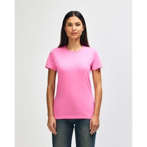 A pink Gildan Softstyle ladies' T-shirt on a model, featuring a classic crew neck and short sleeves.
