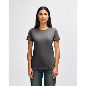 A grey Gildan Softstyle ladies' T-shirt displayed on a model, featuring a classic round neckline and short sleeves.