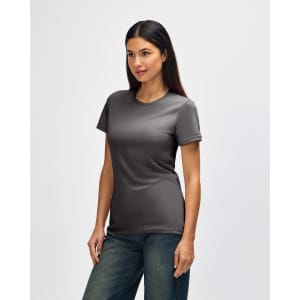 A grey Gildan Softstyle ladies' t-shirt displayed on a model, featuring a fitted design and short sleeves.