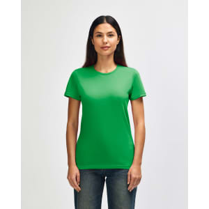 A green Gildan Softstyle ladies' T-shirt displayed on a model, featuring a classic crew neck and short sleeves.