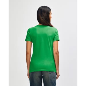 A green Gildan Softstyle ladies' T-shirt is displayed from the back, featuring a fitted design.