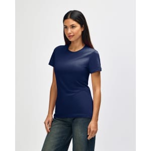 A navy blue Gildan Softstyle ladies' T-shirt displayed on a model, featuring a simple design and short sleeves.