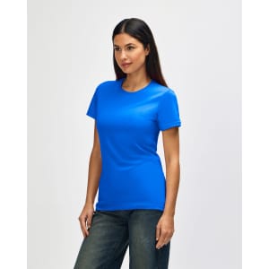 A blue Gildan Softstyle Ladies' T-Shirt displayed on a model, featuring a simple design and short sleeves.