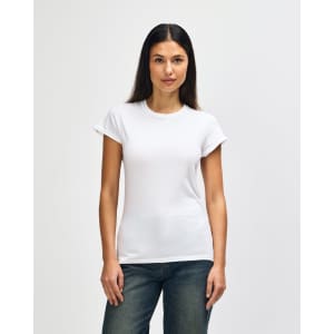 A white Gildan Softstyle ladies' t-shirt displayed on a model, featuring a simple design and short sleeves.