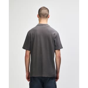 A grey Gildan Softstyle Adult Double Pique Polo displayed from the back. Features a logo on the collar area.