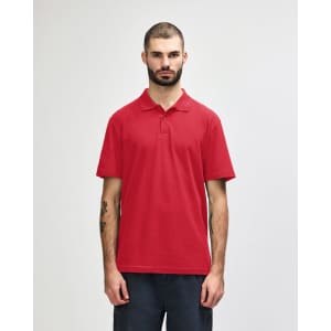 A red adult double pique polo featuring a collar and short sleeves; includes a logo on the chest.