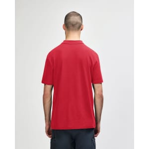 A red adult polo shirt with a collar and short sleeves, featuring a plain design and a logo on the back.