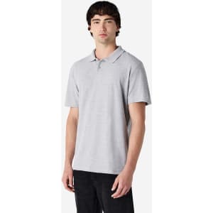 A grey Gildan Softstyle Adult Double Pique Polo with a collar, displayed on a male model. The shirt has a subtle logo.