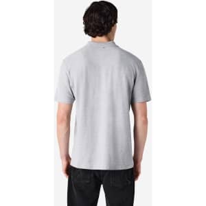 A grey Gildan Softstyle adult double pique polo shirt, viewed from the back, featuring a logo on the collar.