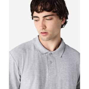A grey Gildan Softstyle adult double pique polo shirt featuring a collar and three-button placket.