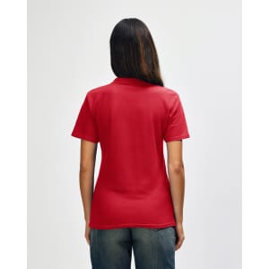 A red ladies' polo shirt with a double pique texture and a logo on the back, displayed on a model.