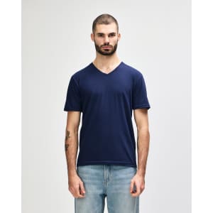 A navy adult v-neck t-shirt displayed on a male model, featuring a subtle logo.